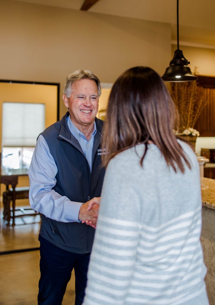 Kyle Stripling of Galloway Insurance assisting a client with flood insurance in Texas.
