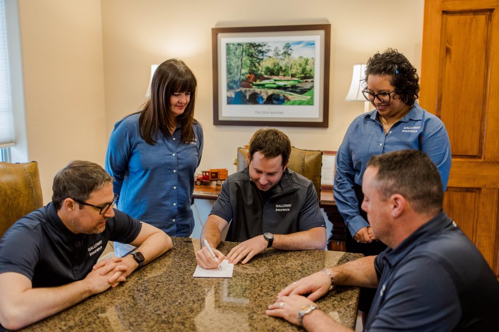 Galloway Insurance agents collaborating to provide customized home insurance solutions in Texas.