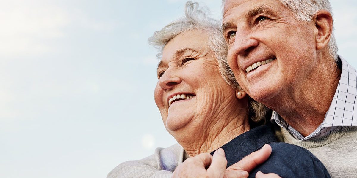 Smiling senior couple enjoying retirement with Medicare insurance coverage in Texas.