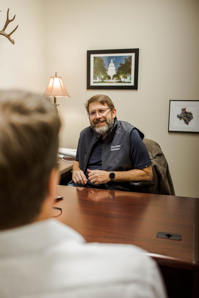 Galloway Insurance agent Joshua Hughes providing classic car insurance consultation in Burnet, TX.
